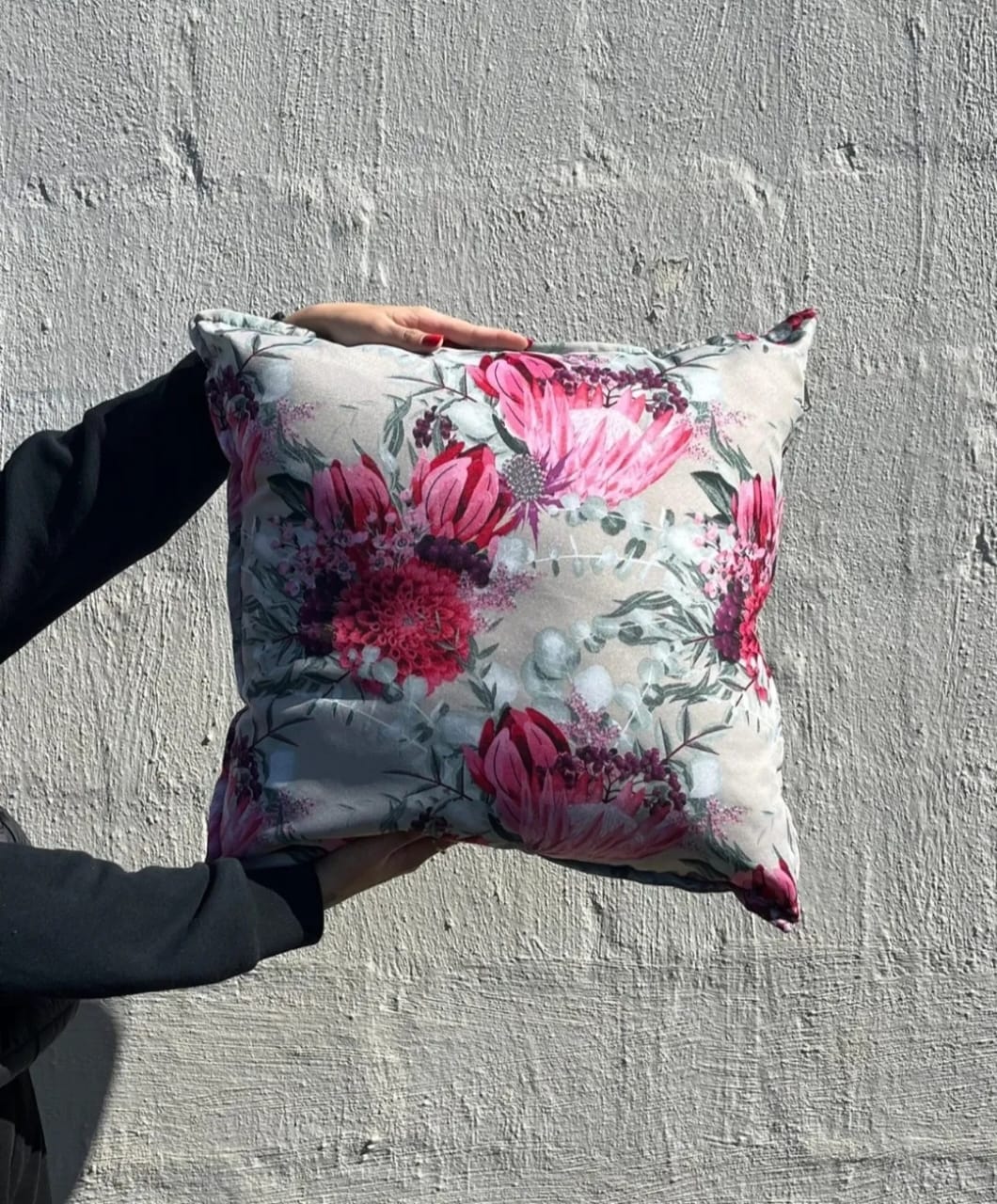 Decorative cushion in pink fabric