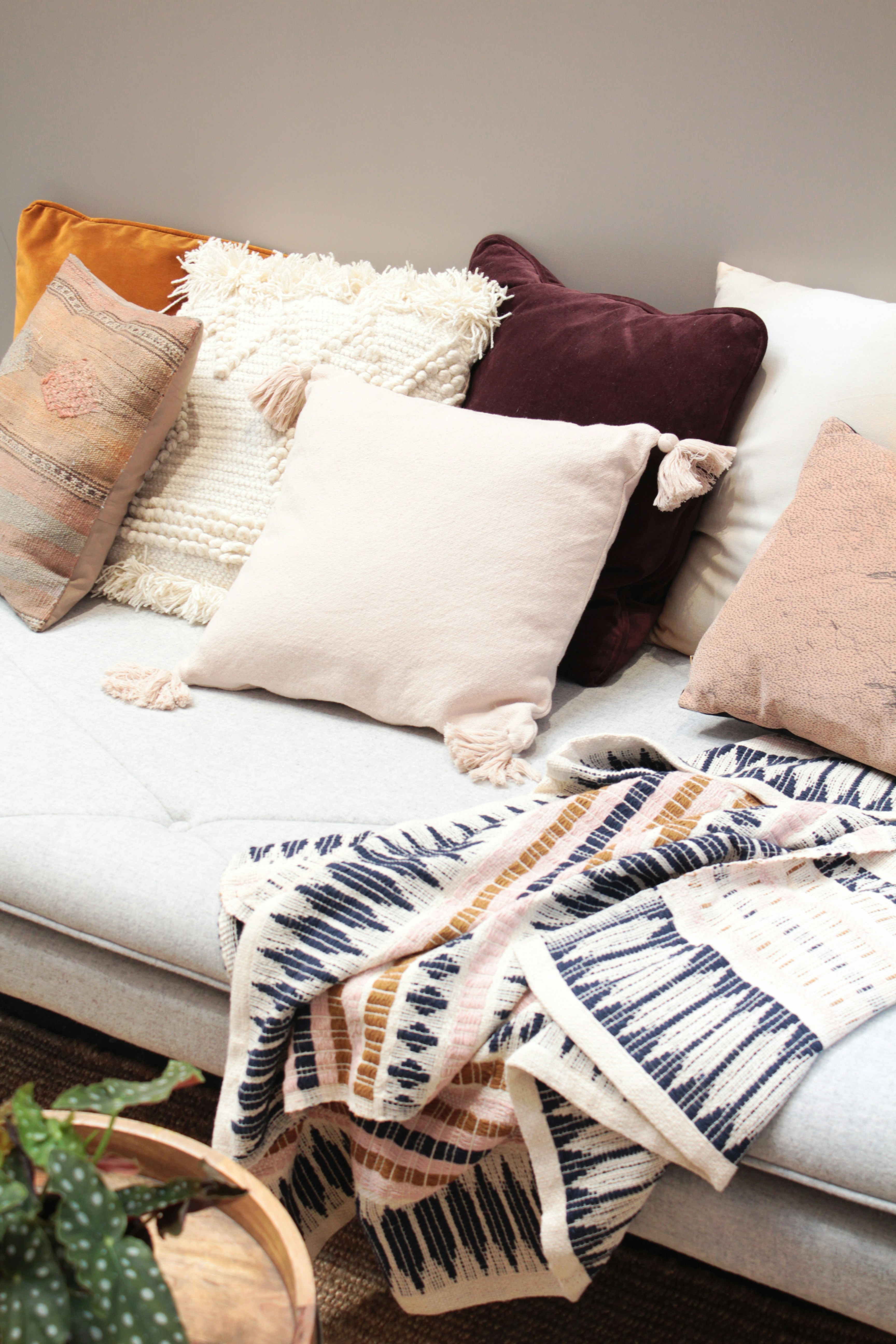 Beautiful cushions and throws — the kind of fabrics available at Amber's