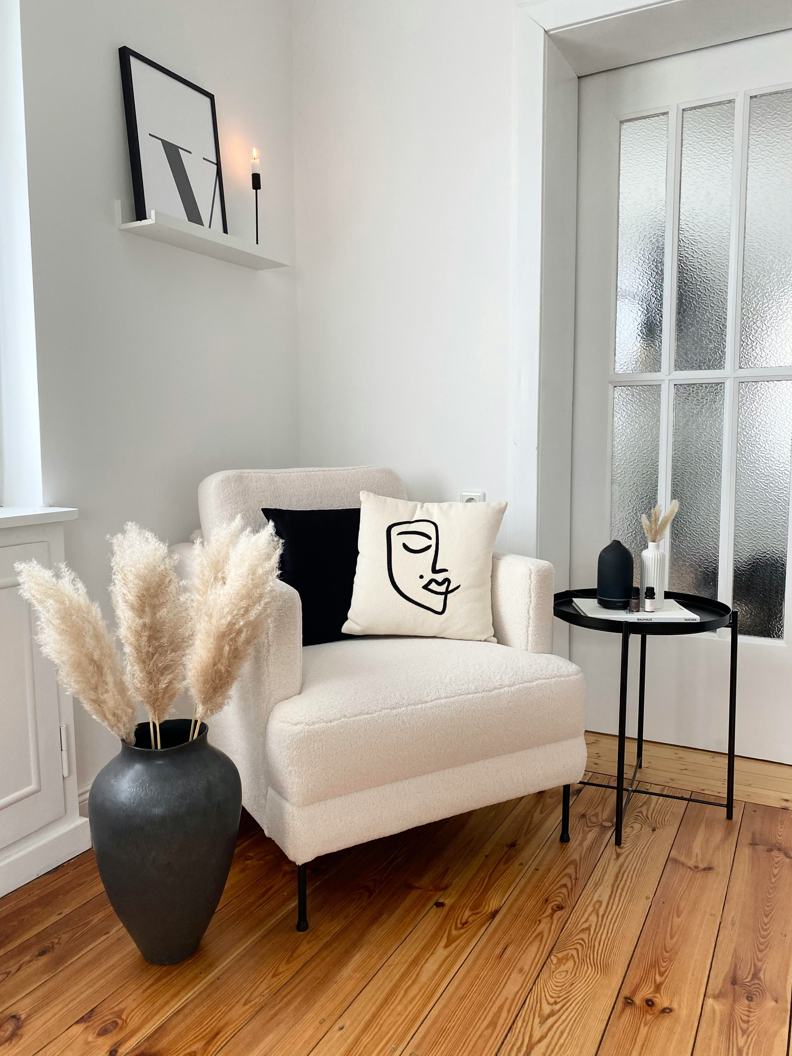 White bouclé armchair — elegant re-upholstery result